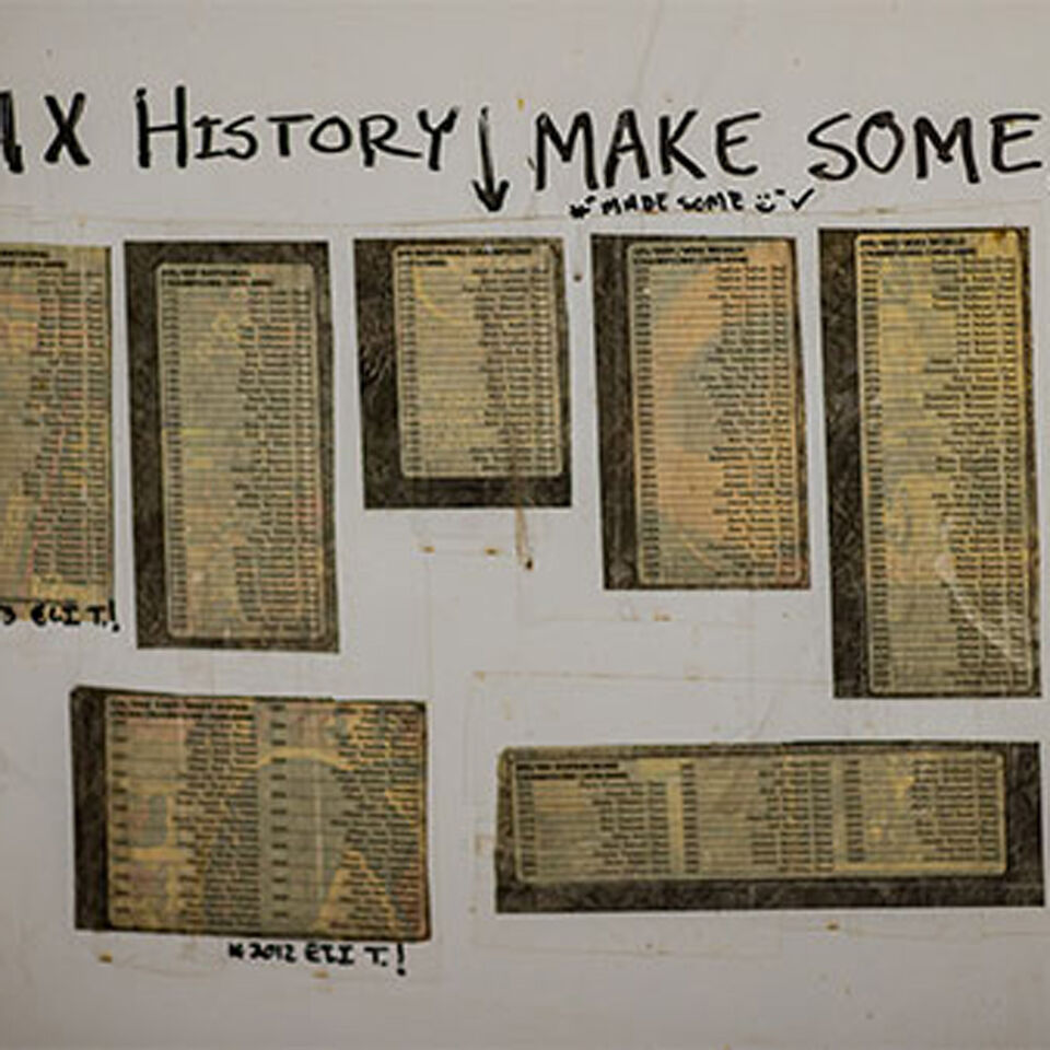 Old papers of race results on a wall