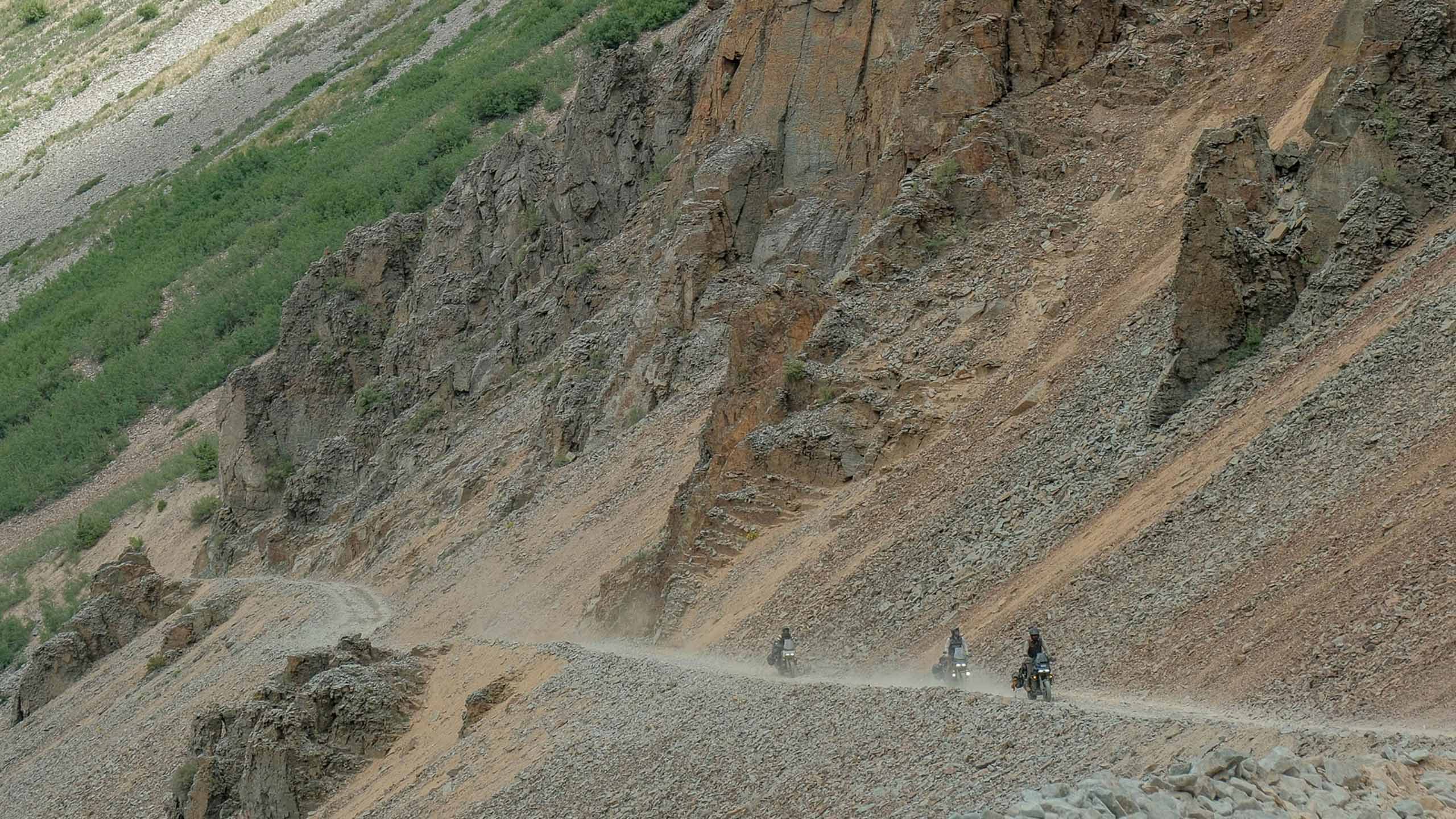 Riders in a bike going uphill on a mountain