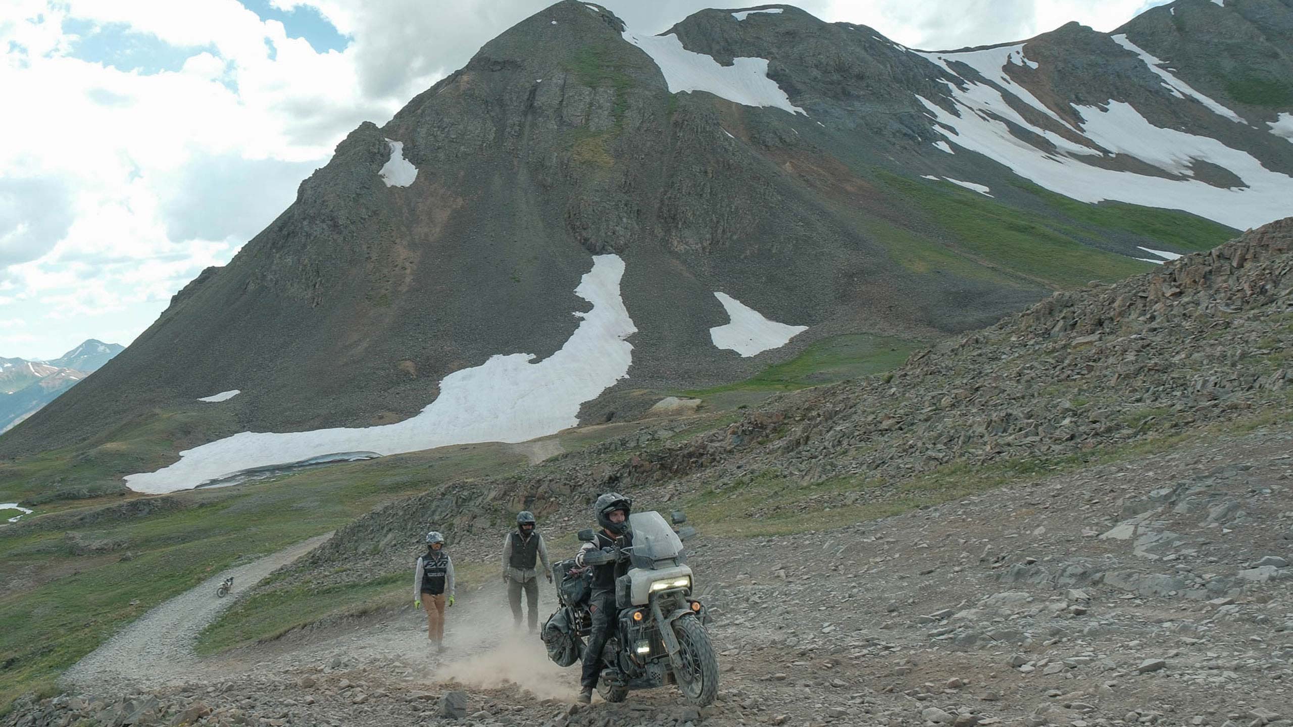 Close up of rider riding his moto uphill in an offroad track